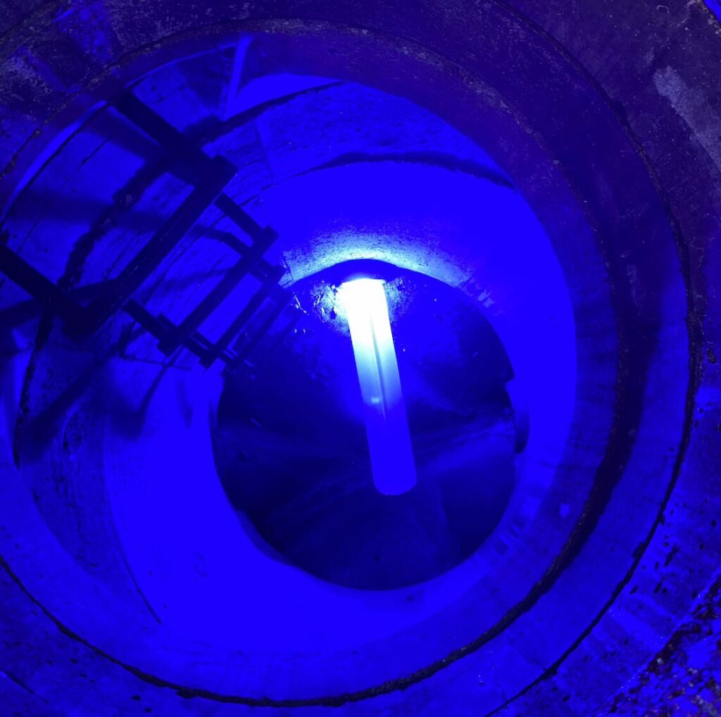 A bright blue light uses to activate resin during the process of sewer line repair in Lee’s Summit.