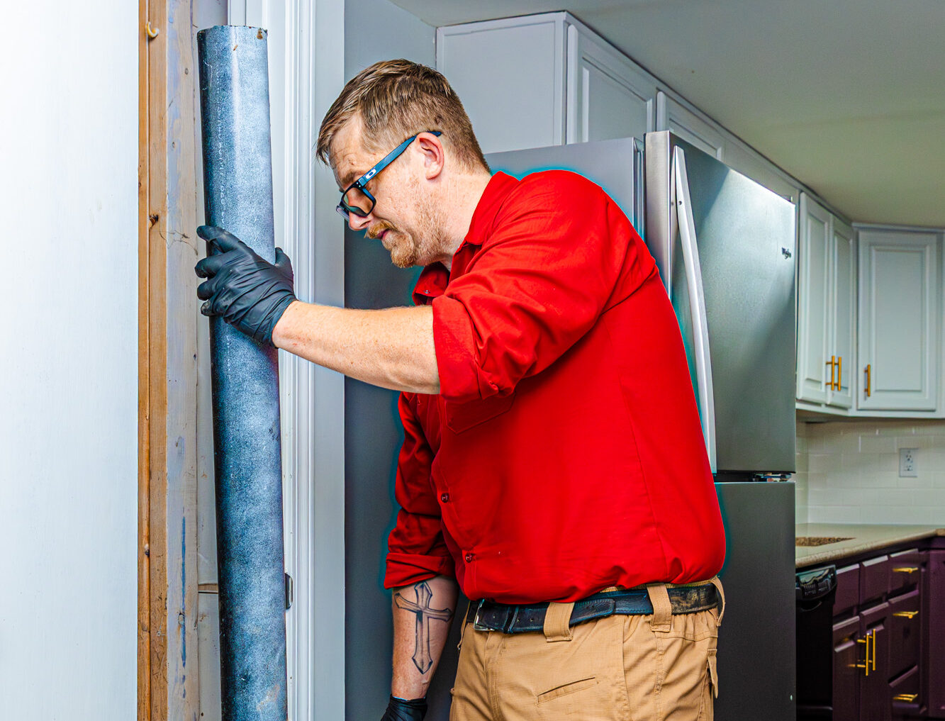One of our team members performs drain cleaning in Johnson County.