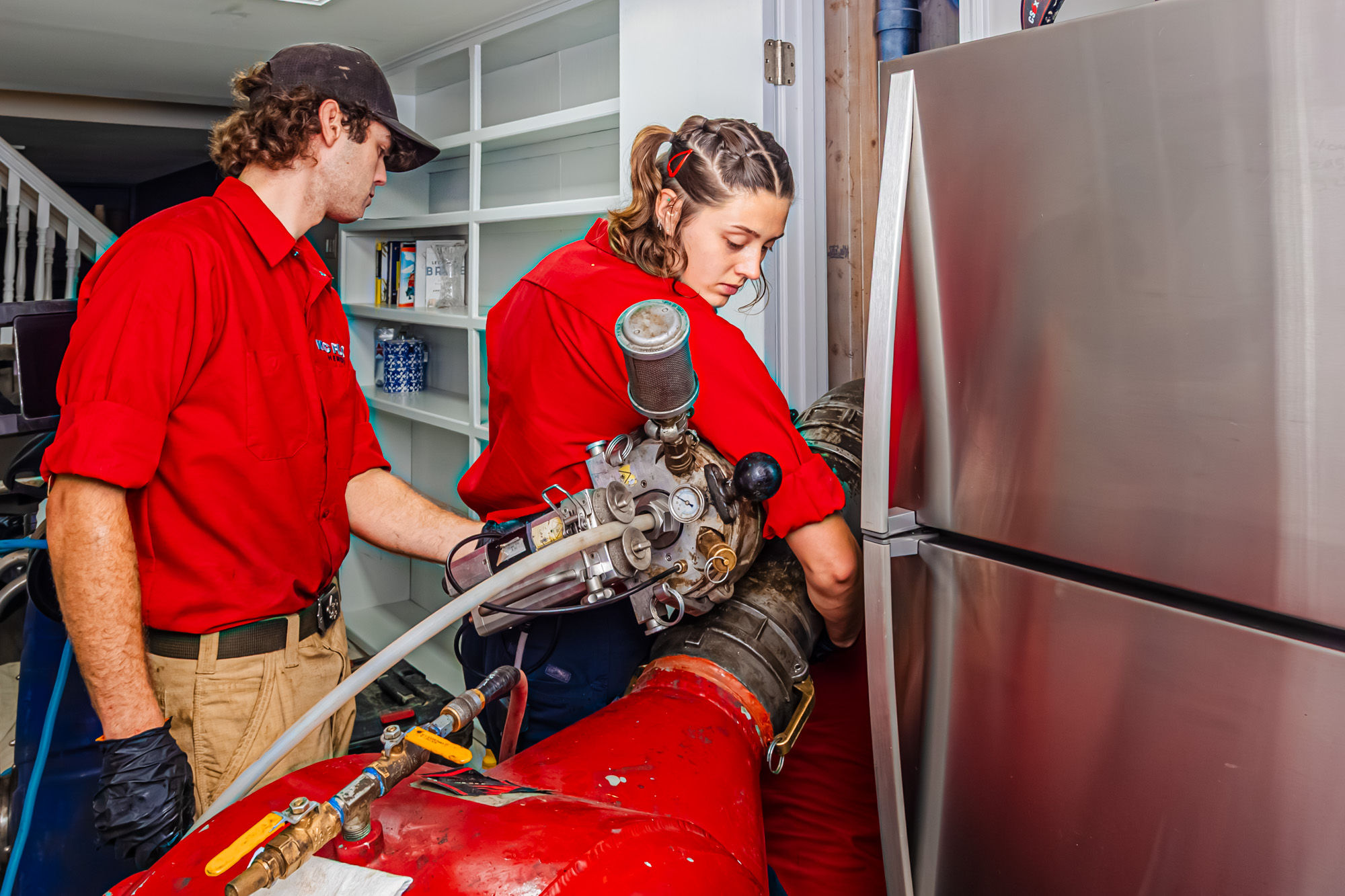 Two members of our team work together to perform drain cleaning in Prairie Village.