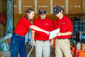 Three members of our team plan a service after a call for a local plumber in Kansas City