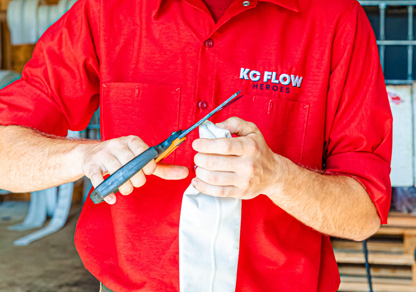 A member of our team cuts lining for sewer repair in Leawood