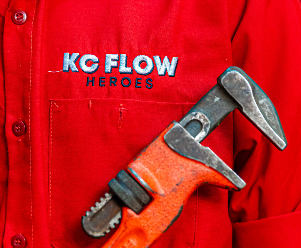 A close-up of our team members' uniform as they perform a plumbing service in Jackson County